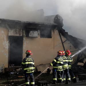 One resident dies in New York nursing home blaze, one firefighter missing