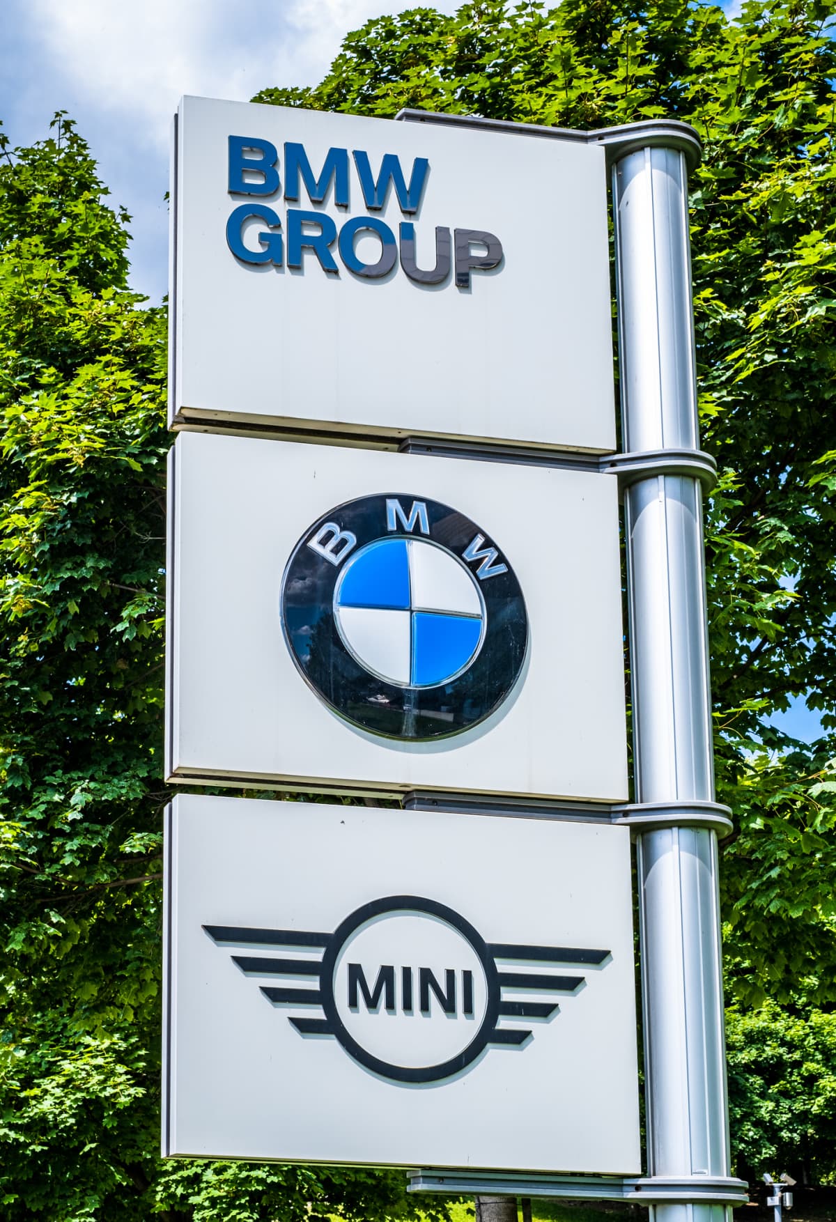 LUHANSK, UKRAINE - 2013/06/09: BMW car company logo in front of dealership building. Bayerische Motoren Werke AG (English: Bavarian Motor Works), commonly known as BMW, is a German automobile, motorcycle and engine manufacturing company founded in 1917. BMW is headquartered in Munich, Bavaria. (Photo by Igor Golovniov/SOPA Images/LightRocket via Getty Images)