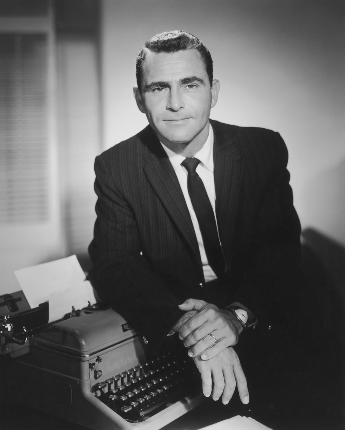 circa 1965:  Studio portrait of American television writer and producer Rod Serling, resting one arm on a typewriter. Serling created the series, 'The Twilight Zone.'  (Photo by Hulton Archive/Getty Images)