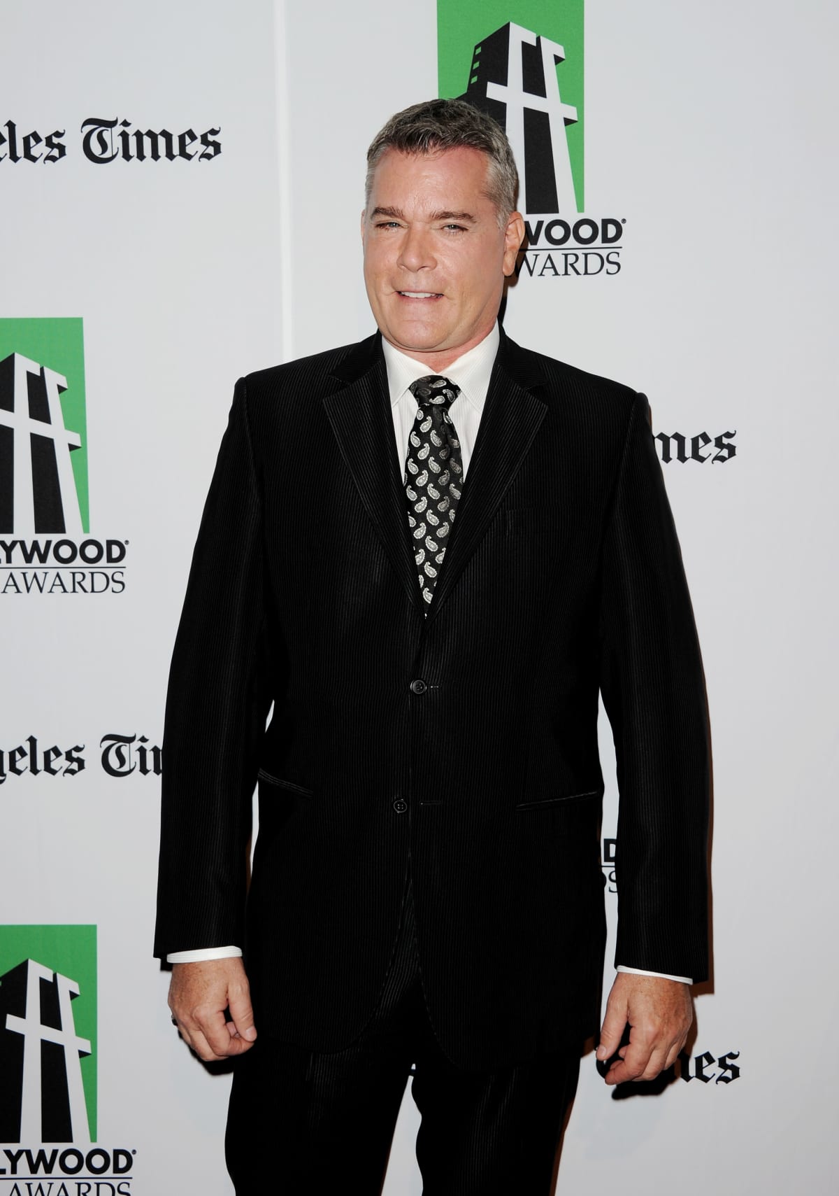 DEAUVILLE, FRANCE - SEPTEMBER 09:  Ray Liotta poses for the photographers after he unveiled his cabin sign as a tribute for his career along the Promenade des Planches during the 40th Deauville American Film Festival on September 9, 2014 in Deauville, France.  (Photo by Francois G. Durand/WireImage)