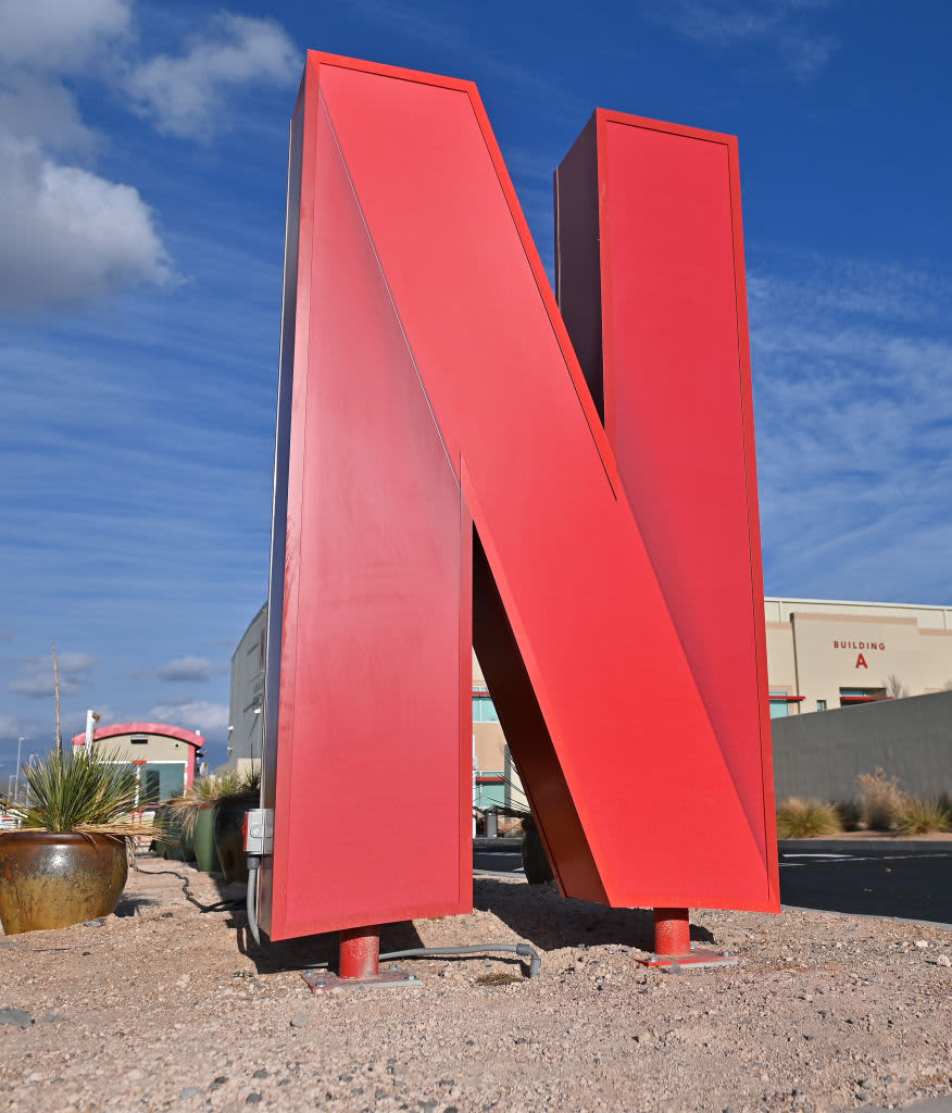 Netflix logo is displayed on a mobile phone screen with Netflix website in a background for illustration photo. Krakow, Poland on January 23, 2023. (Photo by Beata Zawrzel/NurPhoto via Getty Images)