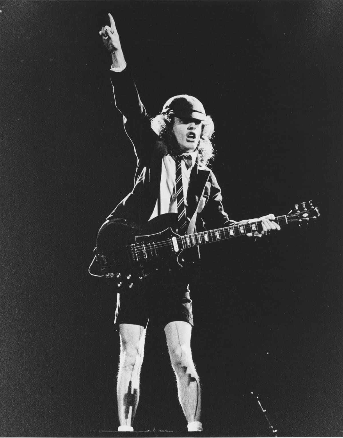 Angus Young of AC/DC performing on stage, Lyceum Theatre, London, United Kingdom on July 7, 1976 from the Lock Up Your Daughters Tour. (Photo by Dick Barnatt/Redferns)