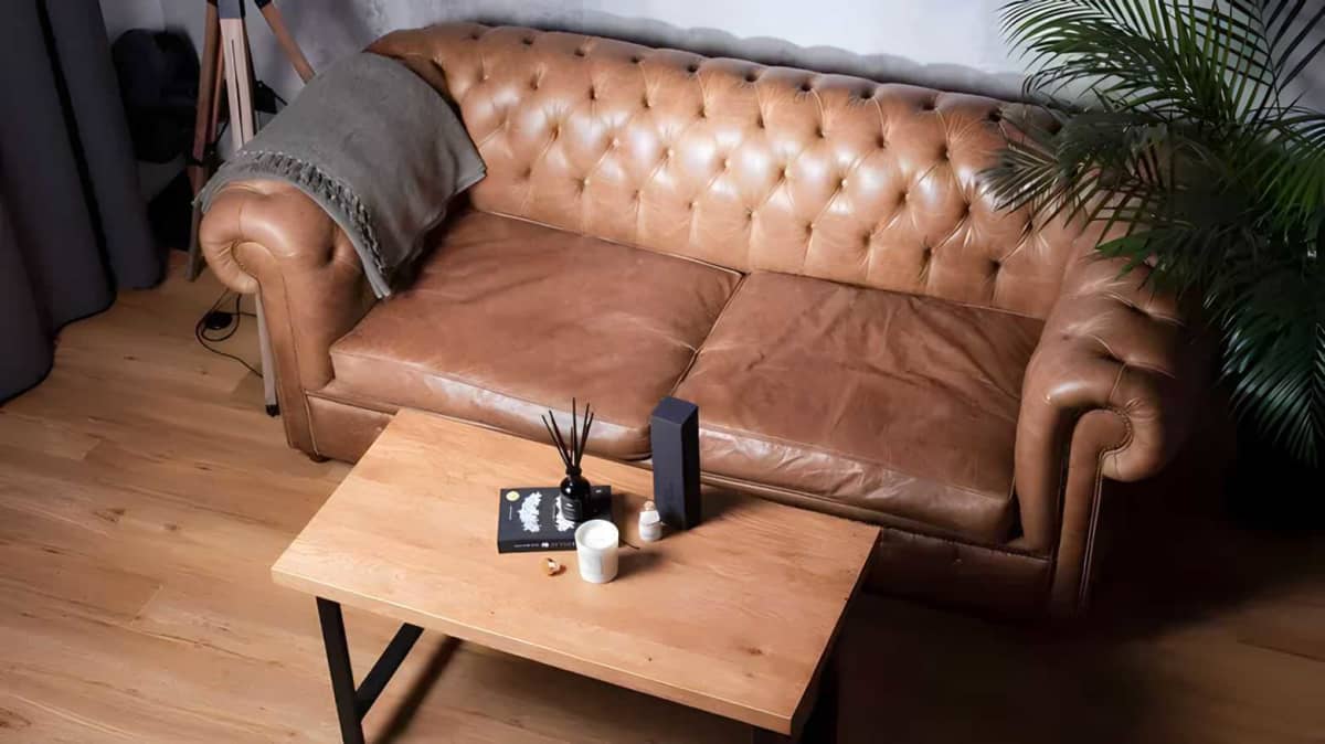Leather couch next to a table
