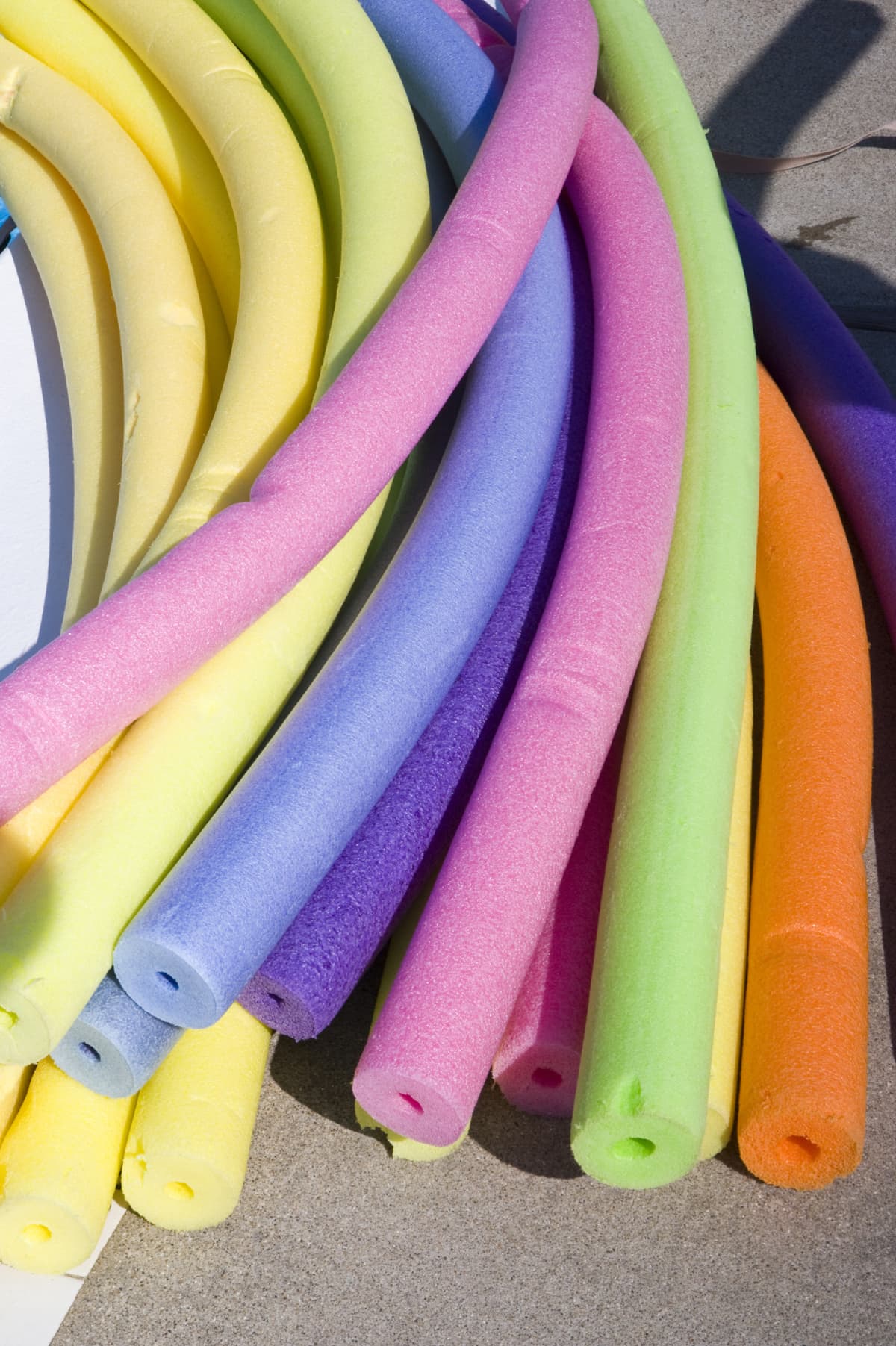 multicolored swimming pool noodles