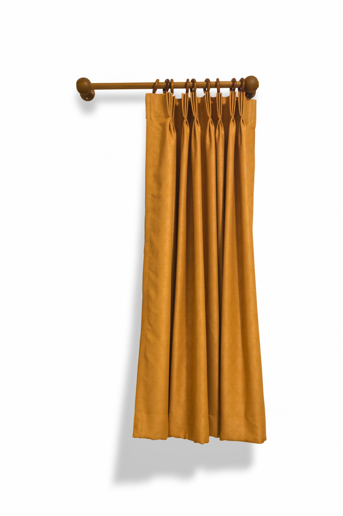 Brown curtains hanging on a rod on a white background