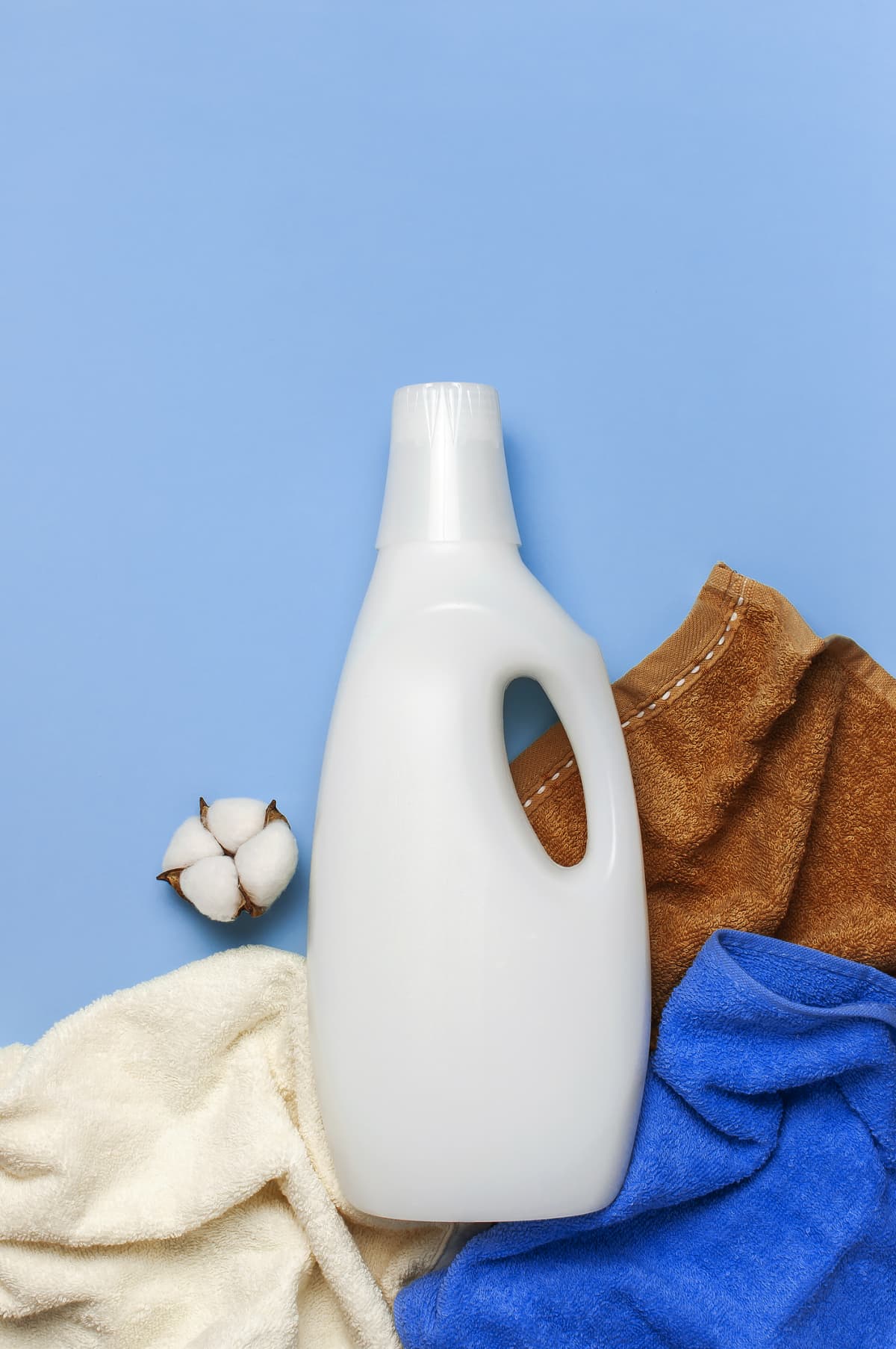 Generic Laundry Detergent Bottle among towels