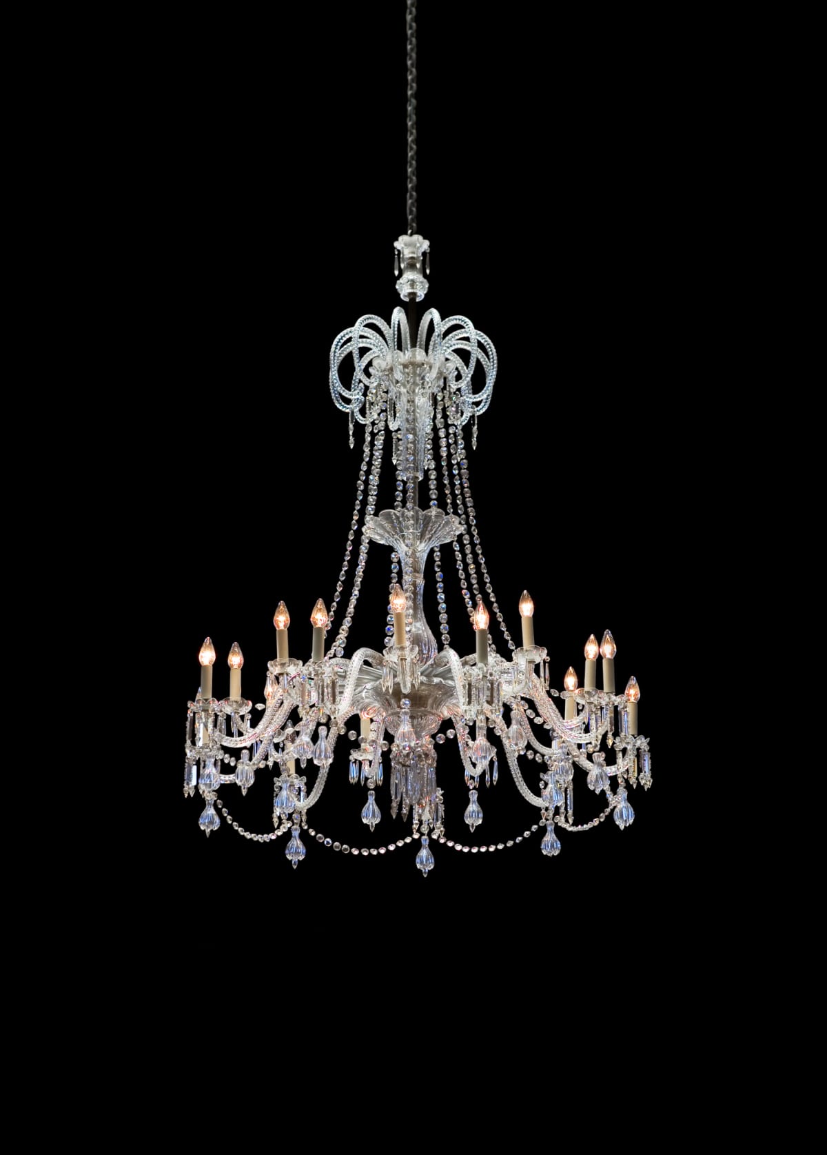 Elegant crystal chandelier on black background