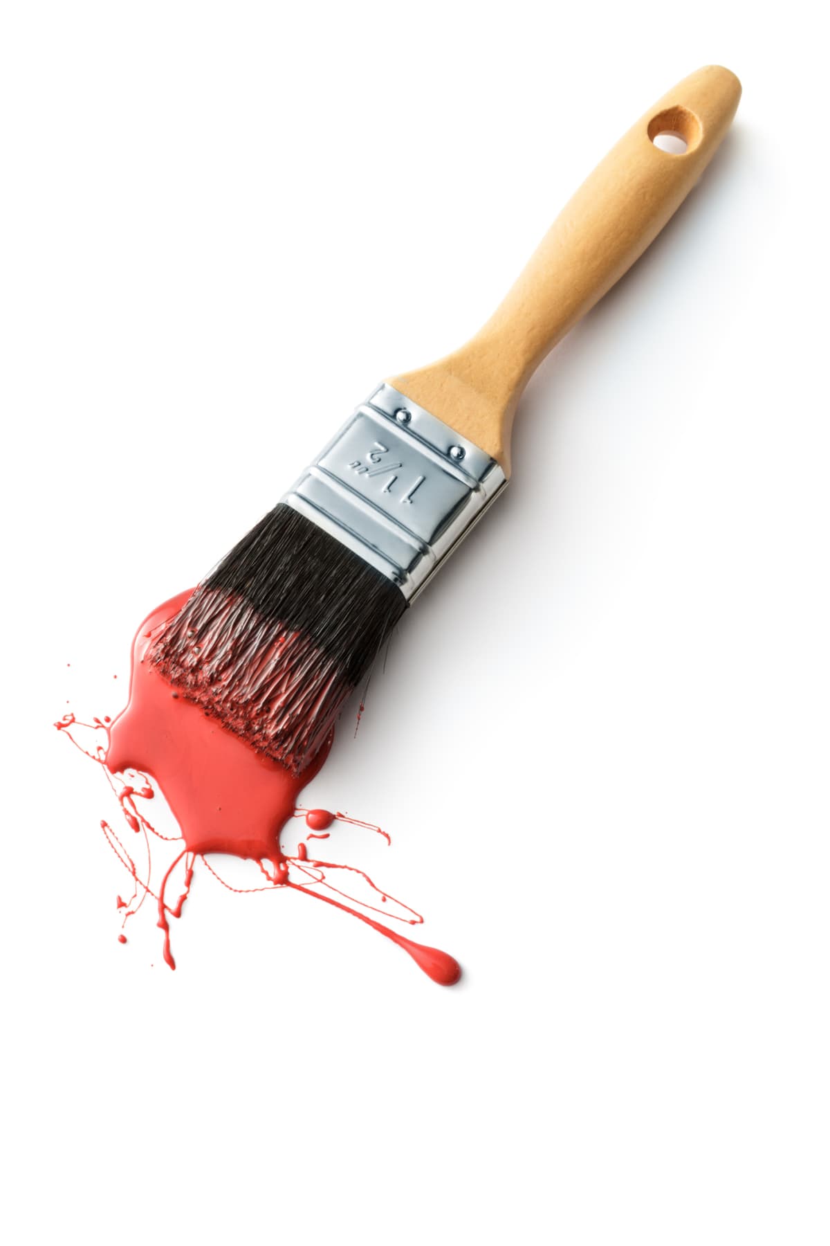 Paint brush with red paint on it isolated on white background