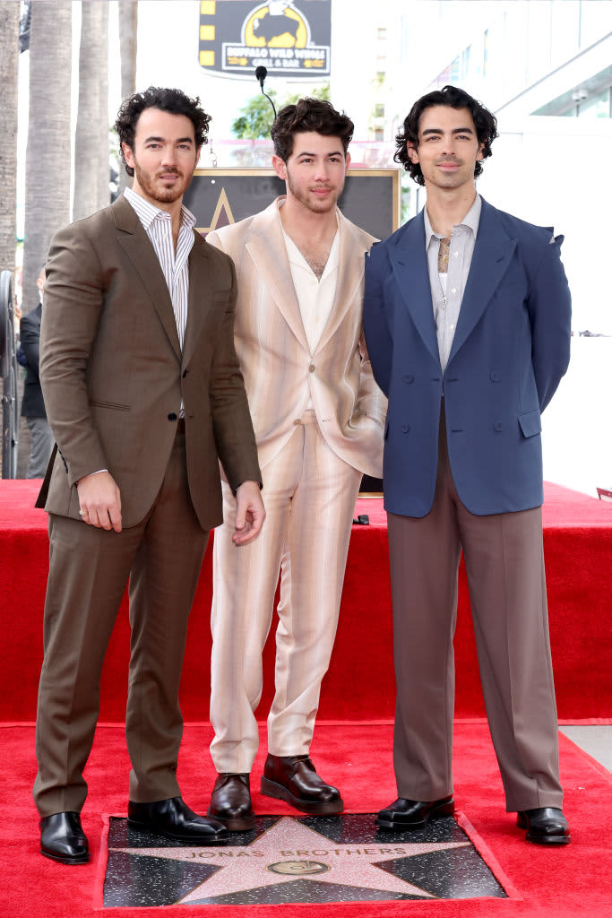 HOLLYWOOD, CALIFORNIA - JANUARY 30: (L-R) Kevin Jonas, Nick Jonas, and Joe Jonas of The Jonas Brothers attend The Hollywood Walk of Fame star ceremony honoring The Jonas Brothers on January 30, 2023 in Hollywood, California. (Photo by Amy Sussman/Getty Images)