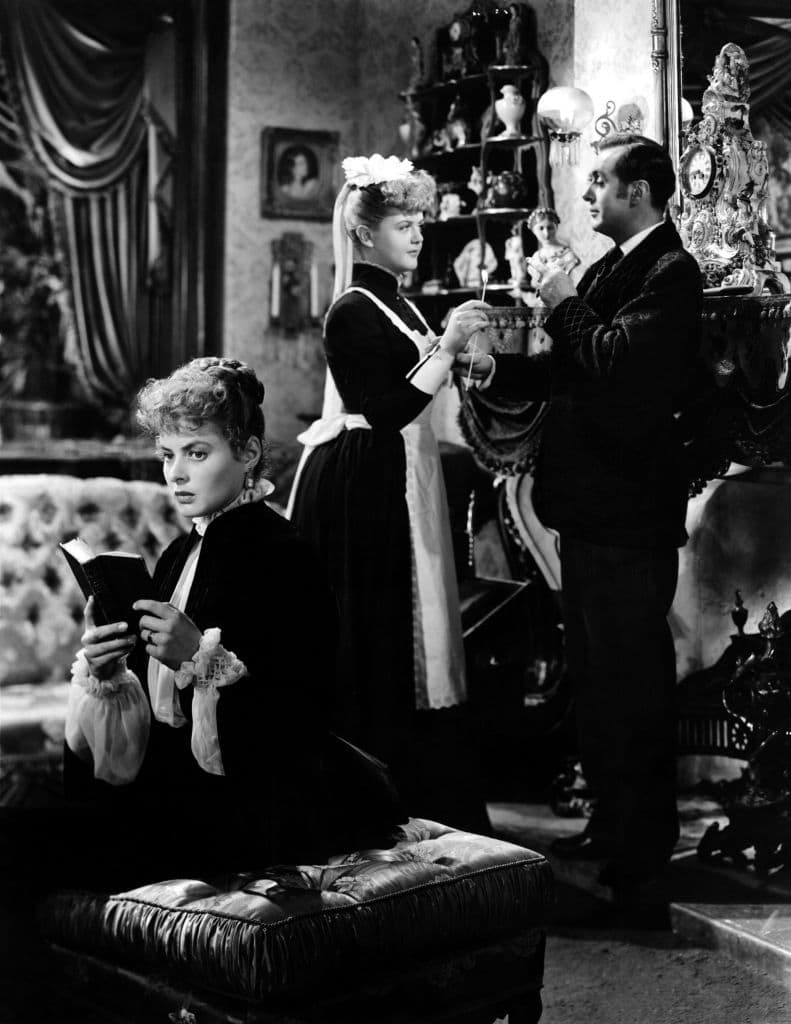 Ingrid Bergman, Angela Lansbury and Charles Boyer  on the set of "Gaslight" directed by George Cukor. (Photo by Metro-Goldwyn-Mayer Pictures/Sunset Boulevard/Corbis via Getty Images)
