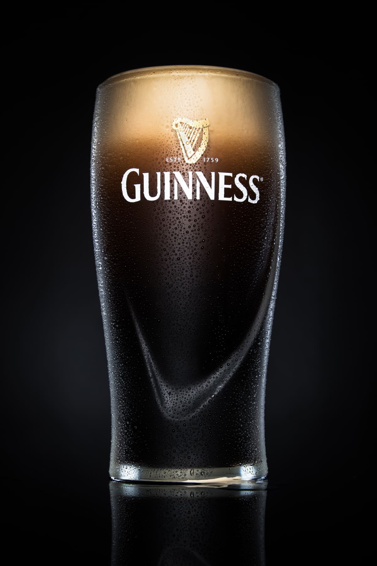 A pint of Guinness beer is pictured in London, on May 9, 2008. Diageo, the alcoholic beverages giant, said Friday it plans to overhaul its Guinness operations in Ireland in a bid to cut costs and boost production of the distinctive black stout. Diageo, the world's biggest maker of alcoholic drinks, said it would close two breweries and renovate its famous St. James's Gate brewery in the centre of Dublin -- where Guinness has been made for the past 250 years. AFP PHOTO/Leon Neal (Photo credit should read Leon Neal/AFP via Getty Images)