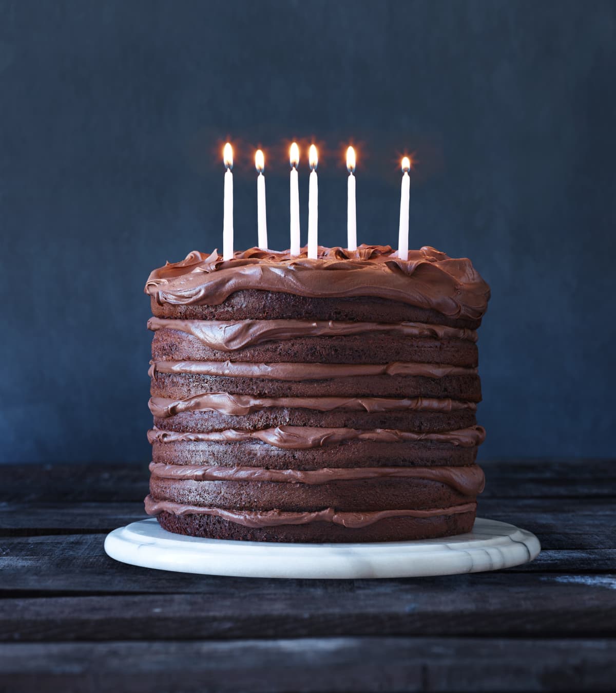 A chocolate cake with candles