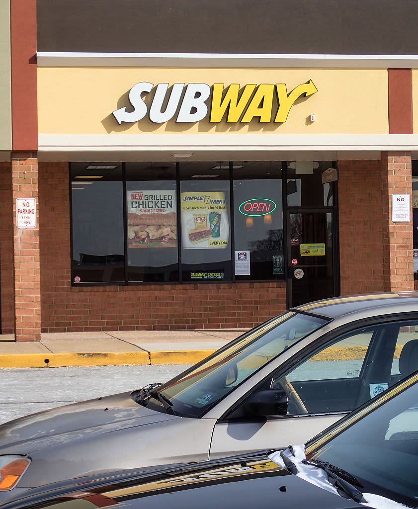 General view of a Subway storefront from parking lot