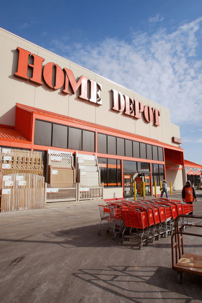 Shopping carts sit outside a Home Depot store