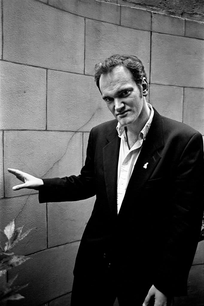 US film director Quentin Tarantino poses 23 May 1994 with the Golden Palm he was awarded for his film "Pulp Fiction", at the 47th Cannes International Film Festival in Cannes. / AFP / PATRICK HERTZOG        (Photo credit should read PATRICK HERTZOG/AFP via Getty Images)