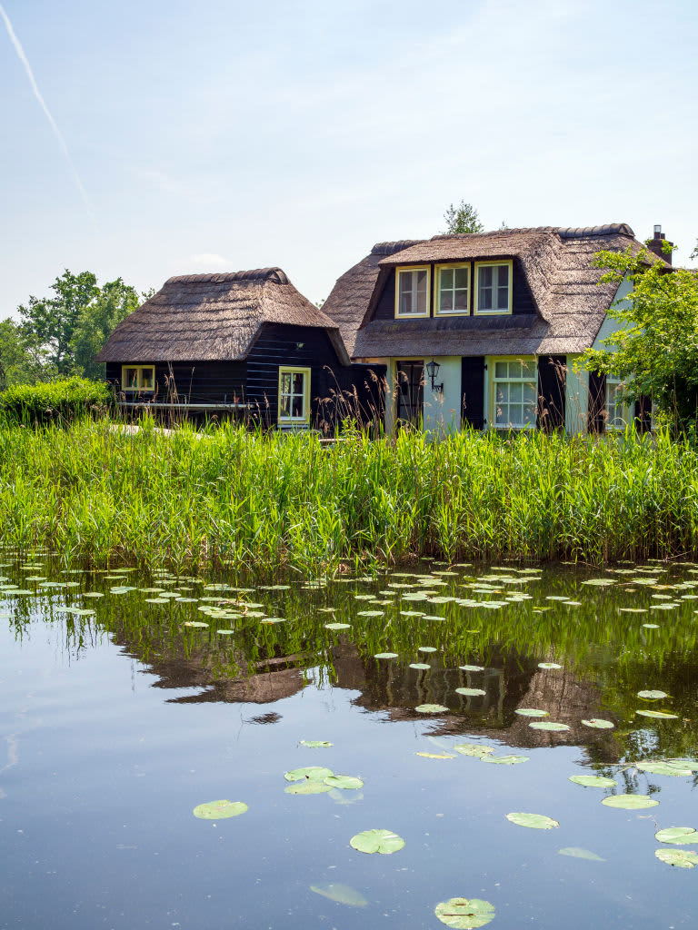 GOOGPAD, ANKEVEEN, NOORD HOLLAND, NETHERLANDS - 2018/05/26: A house in traditional style on the lake 'Ankeveense Plassen', created by peat harvesting, in Ankeveen, The Netherlands. (Photo by Leisa Tyler/LightRocket via Getty Images)