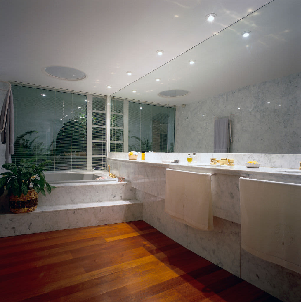 View of a full length mirror in a contemporary bathroom