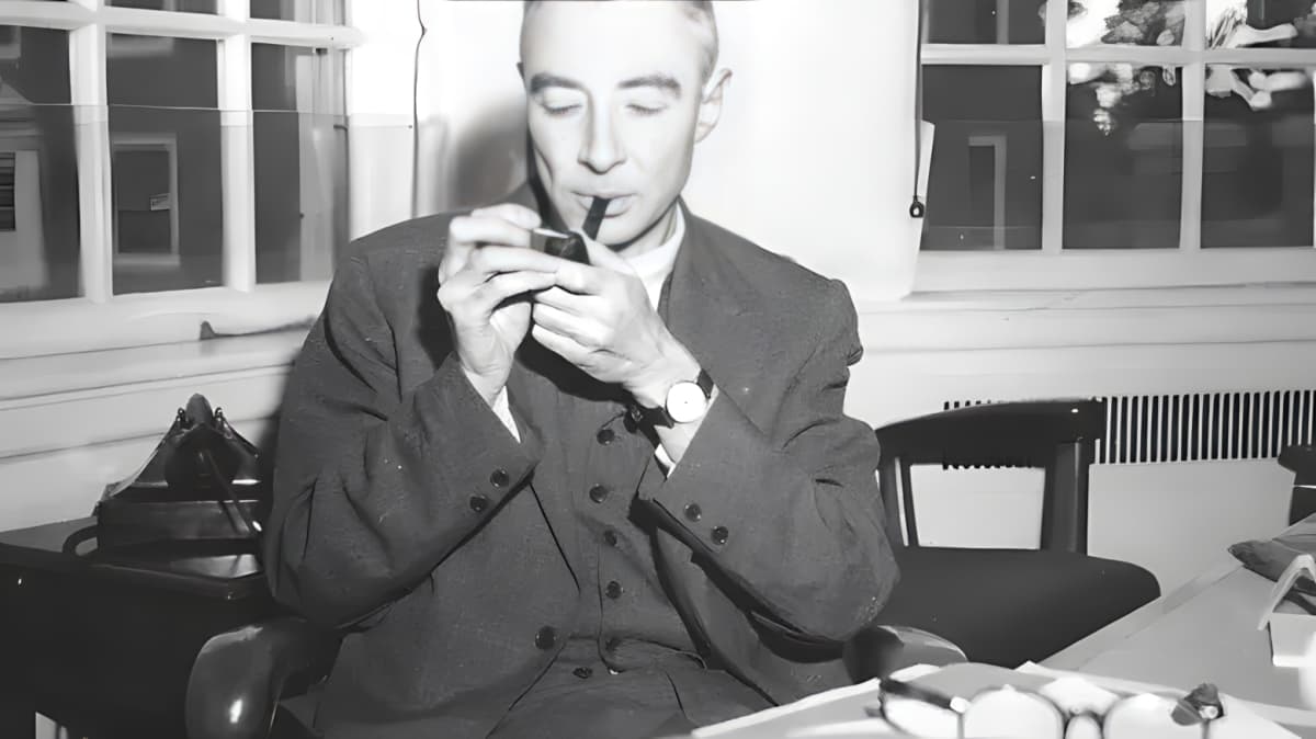 J. Robert Oppenheimer lighing a pipe