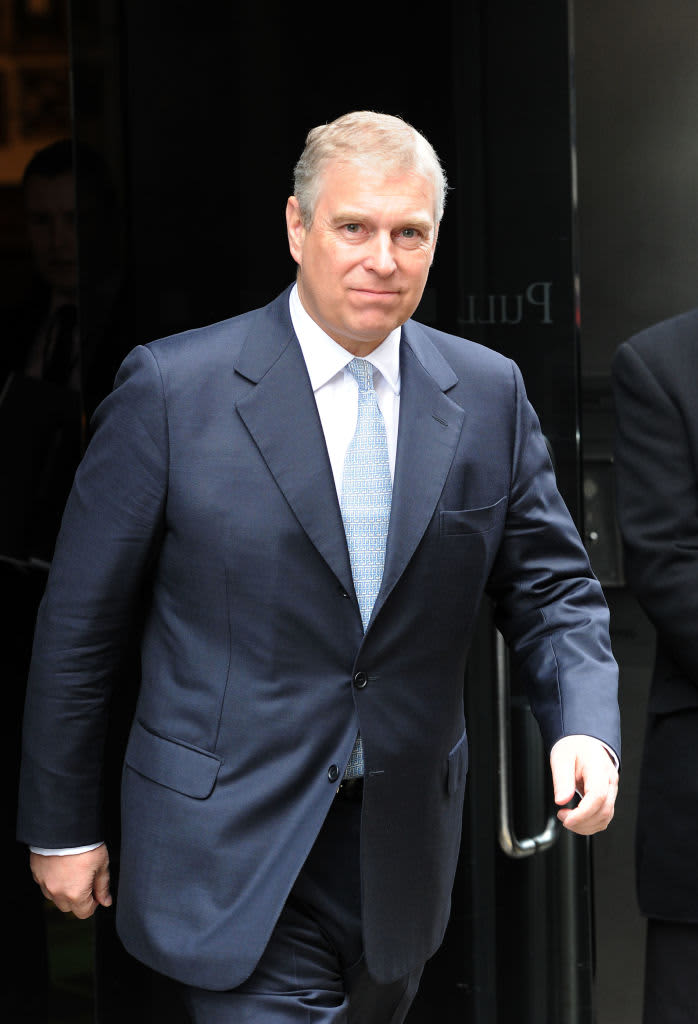 Prince Andrew exits a building