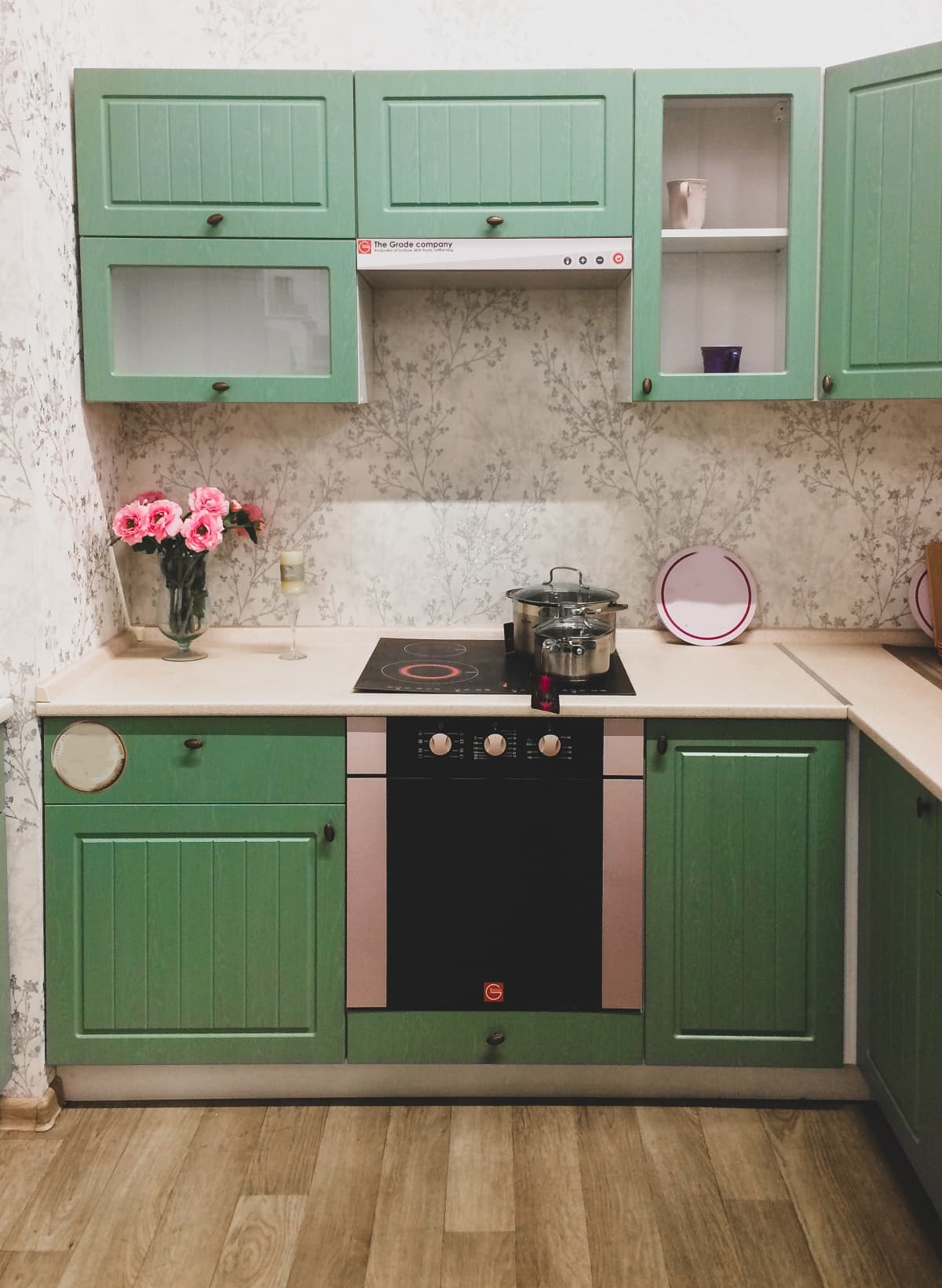 Cozy kitchen. Kitchen furniture in a pleasant green color.