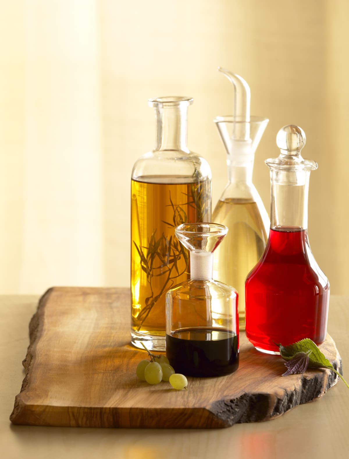 Assorted vinegars on a wooden board