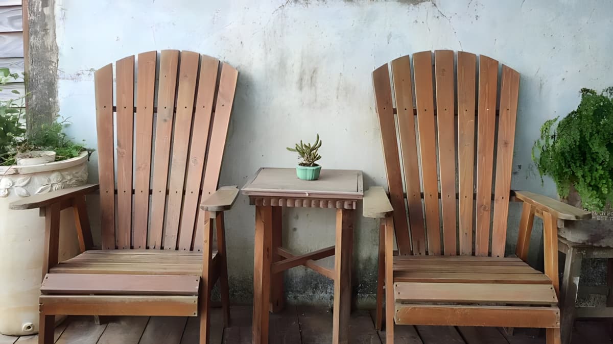 Two outdoor wooden chairs and table.
