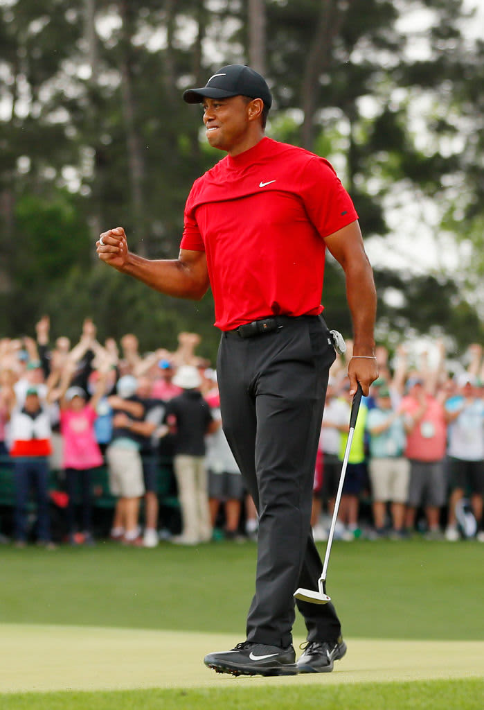 AUGUSTA, GEORGIA - APRIL 14: Tiger Woods of the United States celebrates after sinking his putt on the 18th green to win during the final round of the Masters at Augusta National Golf Club on April 14, 2019 in Augusta, Georgia. (Photo by Kevin C. Cox/Getty Images)